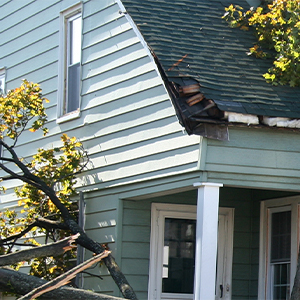 Storm Damage on House Roof and Siding